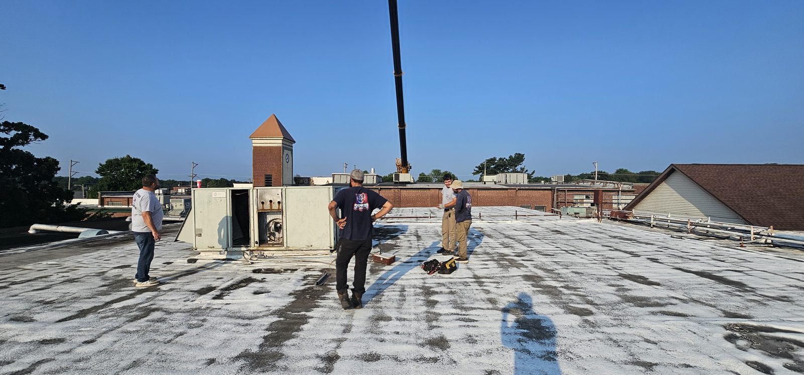 Shepherd HVAC crew preparing a commercial roof for a rooftop unit changeout