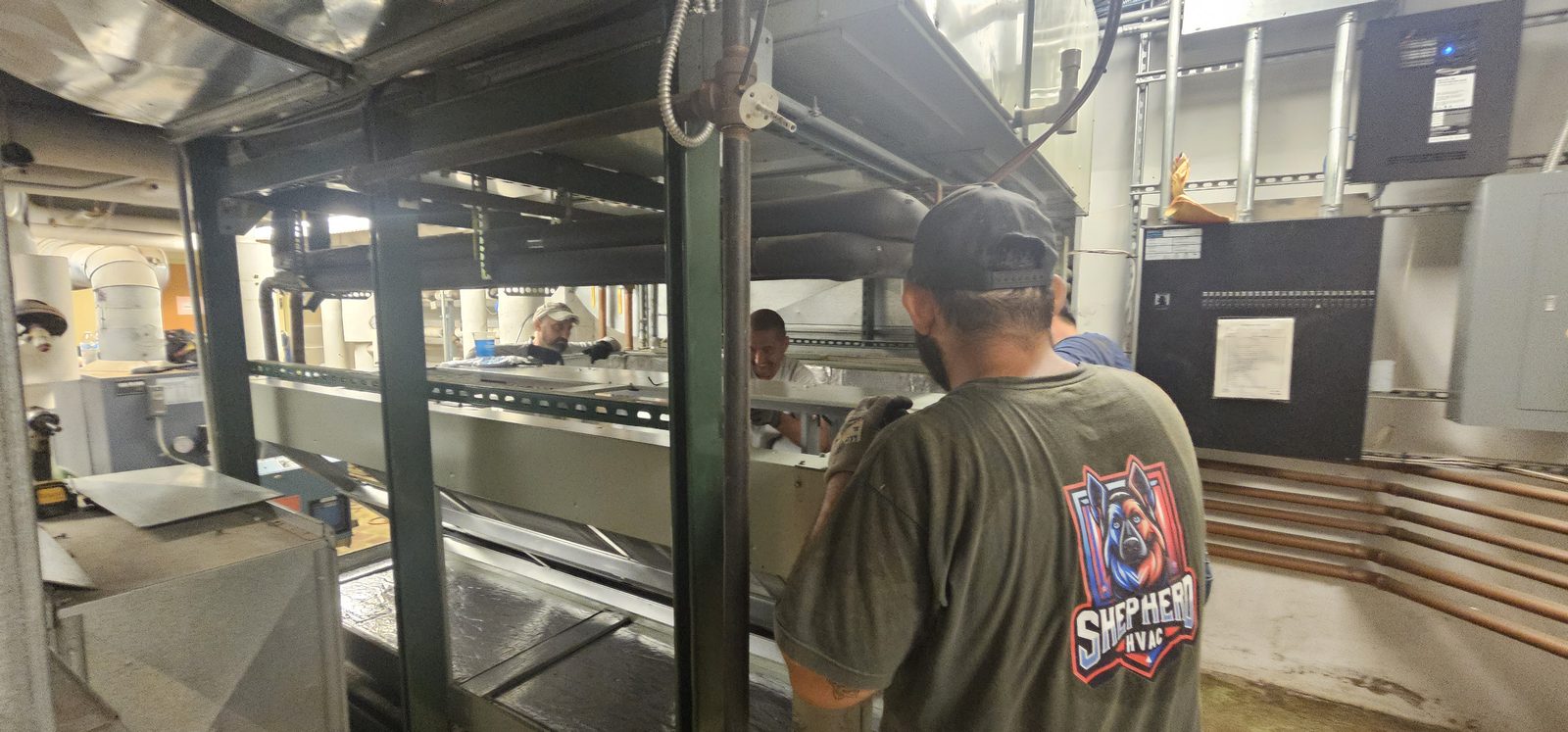 Shepherd HVAC technician checking fit-up on a newly built air handler
