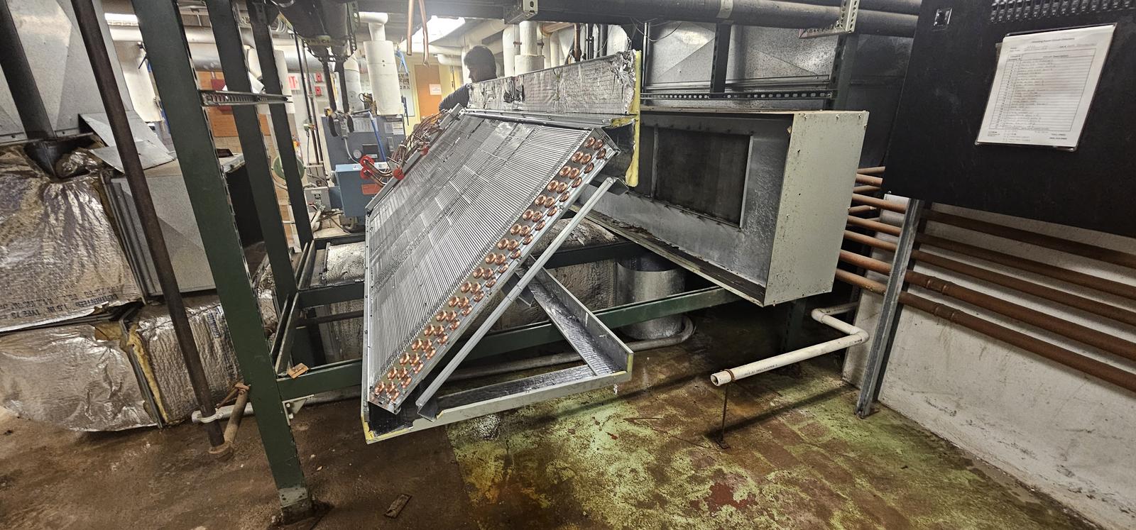 Large evaporator coil and air handler cabinet during a commercial system replacement