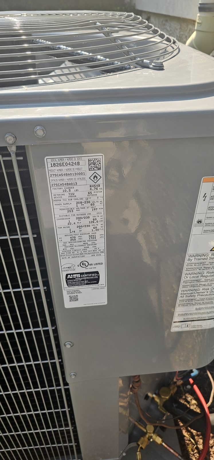 Indoor furnace and air handler cabinet with copper line connections inside a utility closet